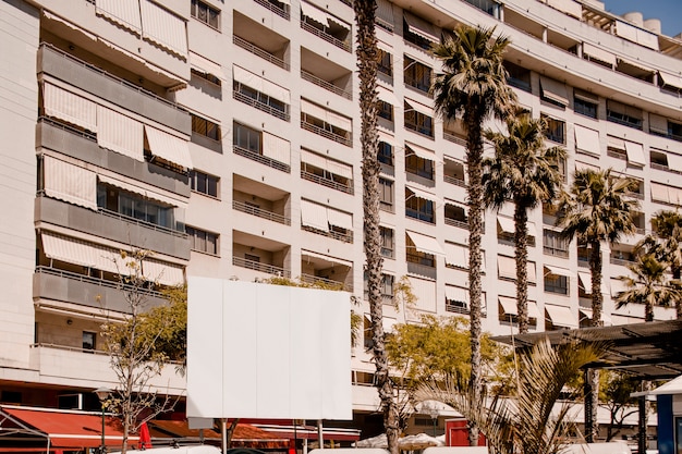 Free photo advertising billboard for in front of residential building