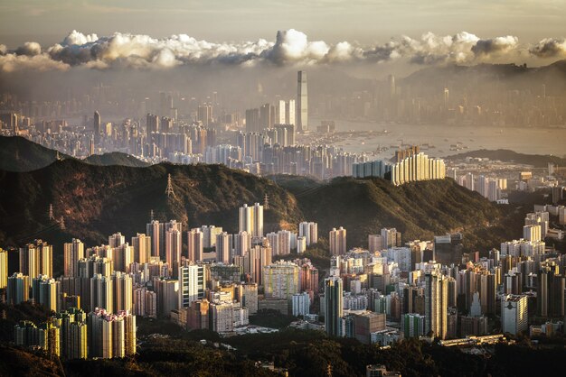 Aerial beautiful shot of city buildings under a cloudy sky