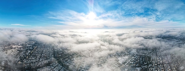 Free Photo aerial drone panorama view of chisinau. multiple buildings, roads, snow and bare trees.