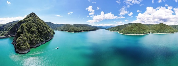 Free photo aerial drone panoramic view of vidraru lake in romania