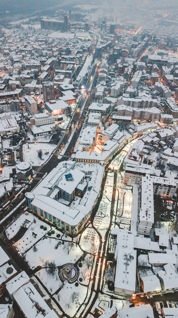 Aerial drone shot of the beautiful city architecture at daytime during Winter