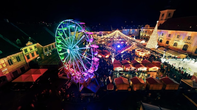 Aerial drone view of The Big Square in Sibiu at night Romania Old city centre decorated