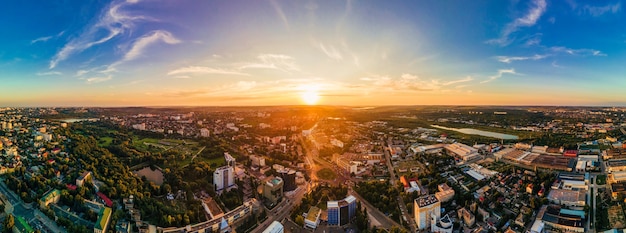 Free photo aerial drone view of chisinau downtown panorama view of multiple buildings roads park with lush