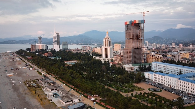 Aerial drone view of the coastline in Batumi Georgia Black sea buildings greenery mountains