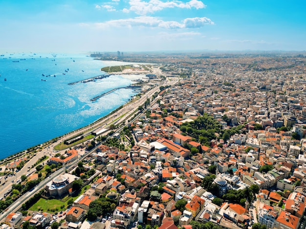 Free photo aerial drone view of istanbul turkey bosporus strait with multiple floating ships sea port multiple buildings