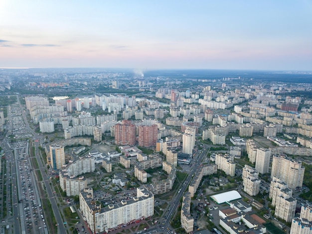 Free photo aerial panoramic photography from the drone bird's eye view to pozniaky district mykoly bazhana ave modern building of the city kiev at sunset in the summer