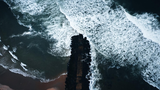 Aerial shot of beautiful sea waves in the daylight perfect for wallpapers