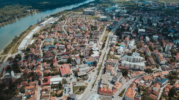 Aerial shot of the Brcko district full of tiny buildings on a sunny day