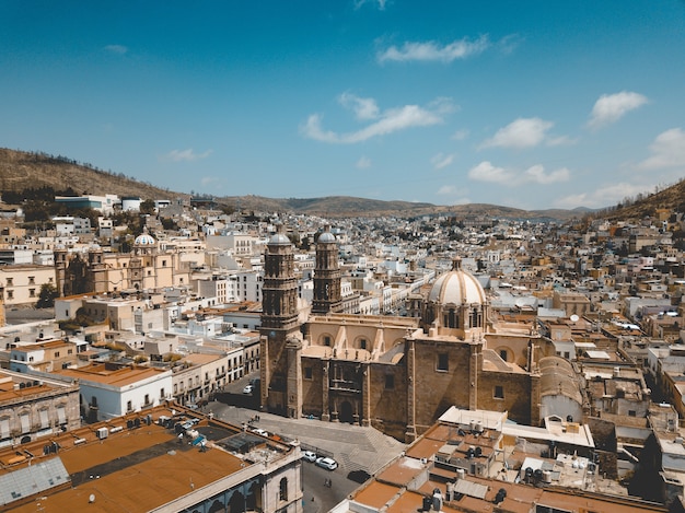 Aerial shot of the cathedral in Zacatecas Mexico under a blue sky at daytime