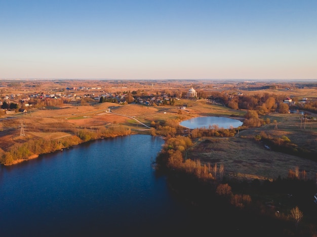 Aerial shot of a city with lakes during autumn in the USA