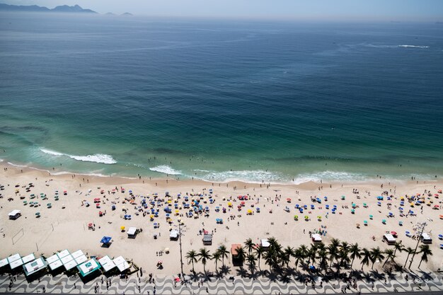 Aerial shot of Copacabana beach in Rio de Janeiro Brazil crowded with people