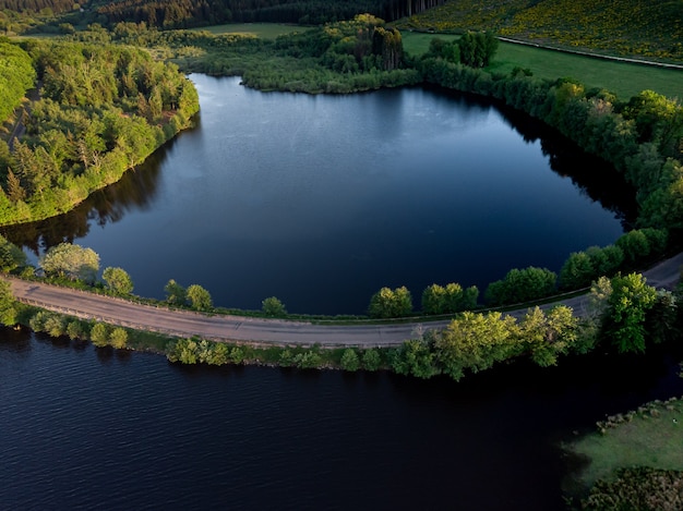 Free Photo an aerial shot of an empty road over the river