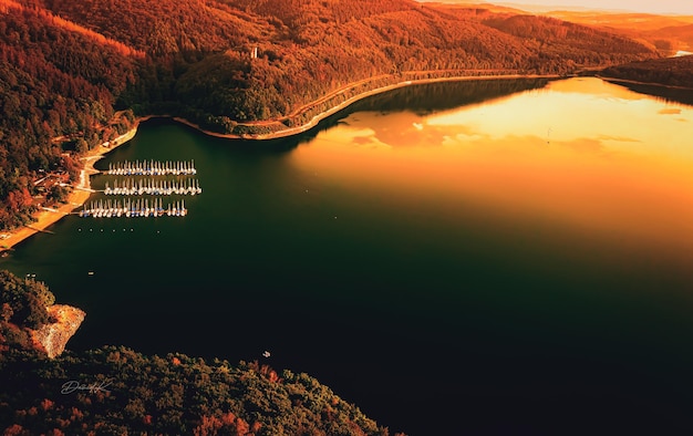 Aerial shot of a harbor at a beautiful bay at sunset