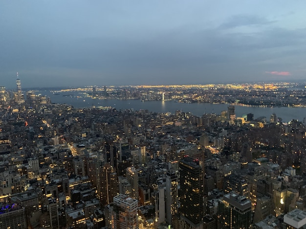 Aerial shot of a megapolis with illuminated high buildings