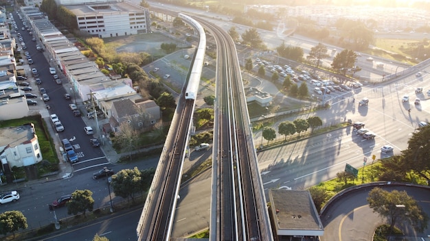 Free photo aerial shot of the san francisco bay area rapid transit  the  train approaches daly city station,