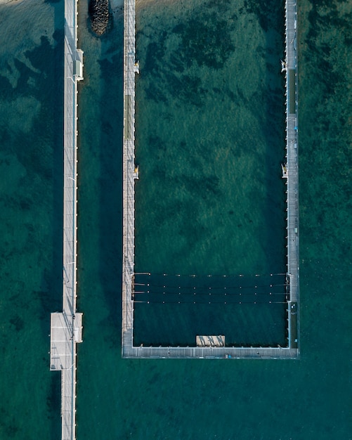 Aerial shot of the sea and a sea pool at the coast