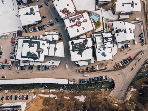 Aerial shot of the ski resort covered in snow in the Alps