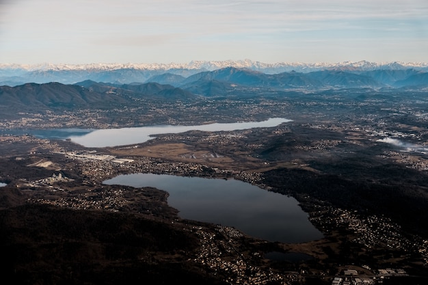 Aerial shot of a suburban valley with scenic lakes