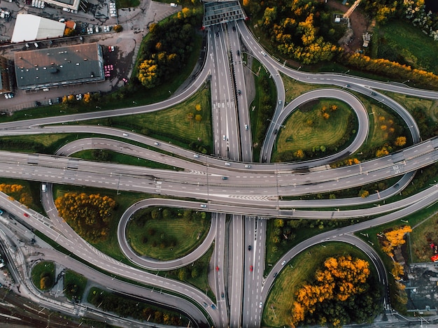 Free Photo aerial shot of twisted roads surrounded by parks in the middle of the city