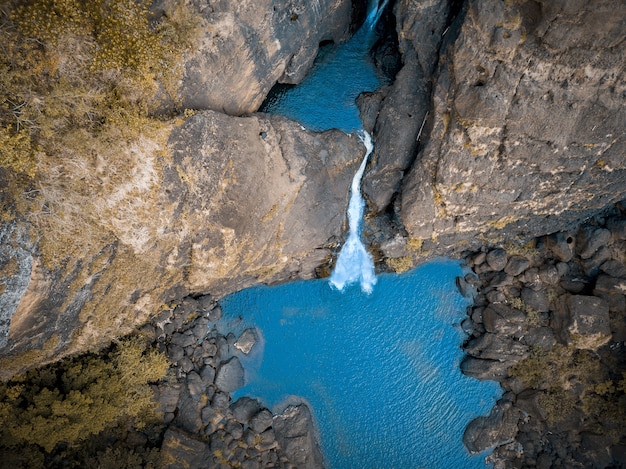 Free Photo aerial shot of a waterfall in papua new guinea