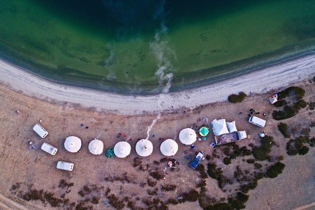 Free Photo aerial shot of white tents on a beautiful beach