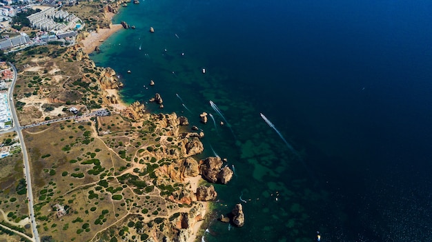 Free Photo aerial view of beautiful cliffs and beach near lagos city in algarve coast at portugal