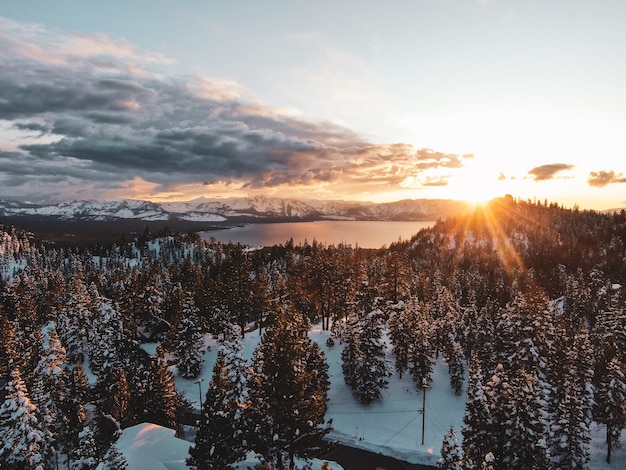 Aerial view of the beautiful Lake Tahoe captured on a snowy sunset in California, USA