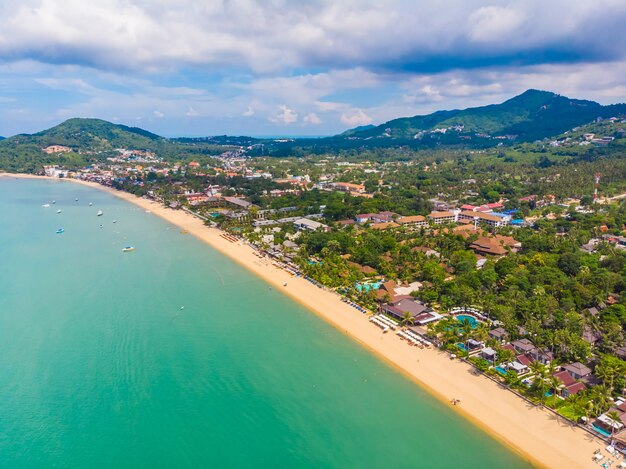 Aerial view of beautiful tropical beach and sea with palm and other tree in koh samui island