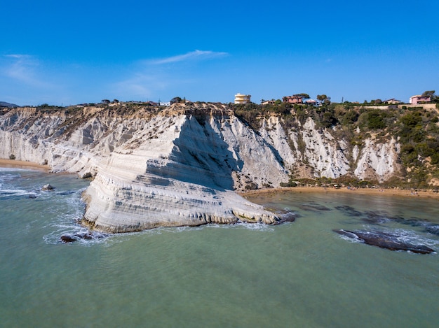 Aerial view of the beautiful white cliffs by the sea in Sicily, Italy