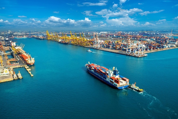 Aerial view of cargo ship and cargo container in harbor