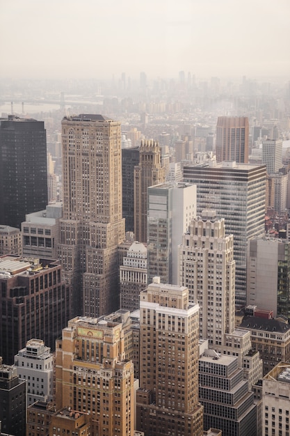 Aerial view of city under cloudy sky during day time