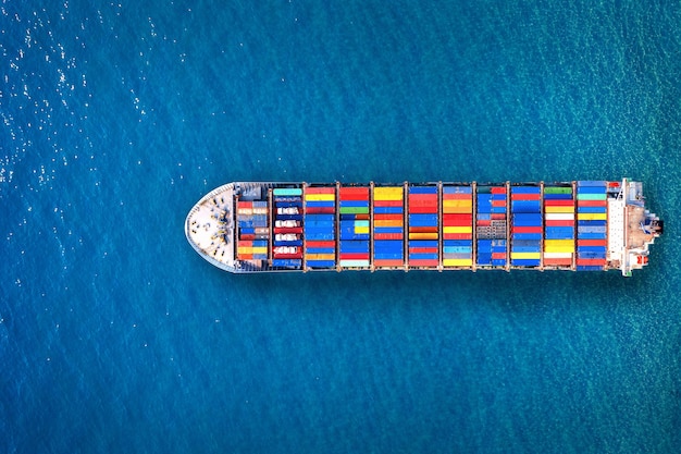 Free photo aerial view of container cargo ship in sea.