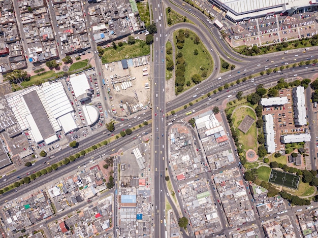 Aerial view of a landscape of a city with a lot of highways, buildings, and transportation