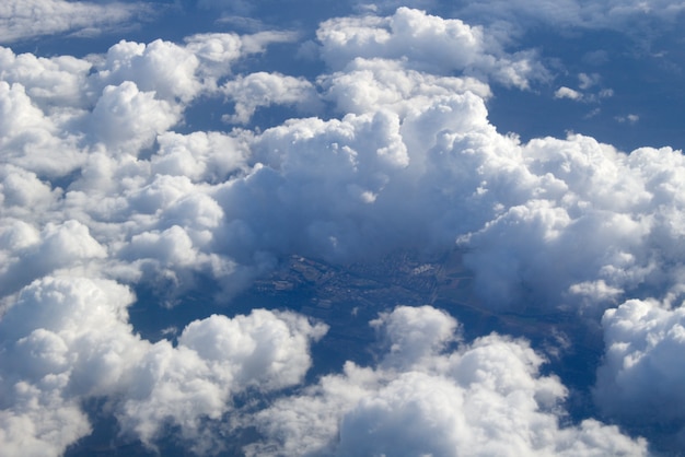 Free Photo an aerial view of large cumulus clouds in the air