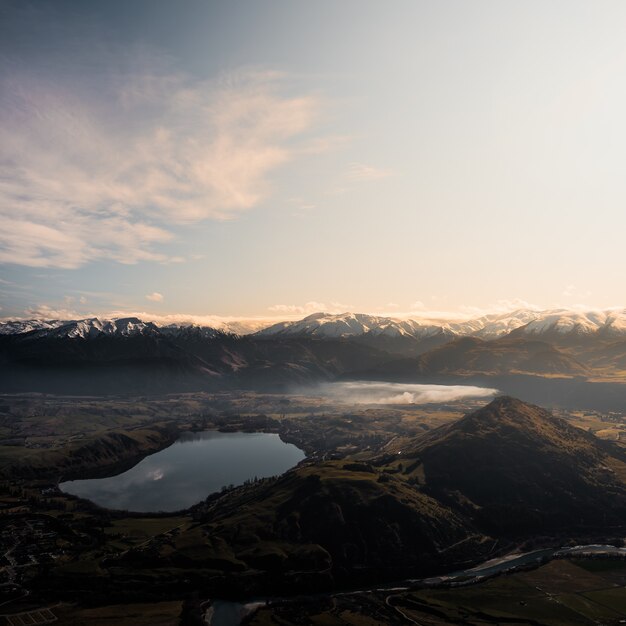 Free Photo aerial view of a mountain lake at sunset