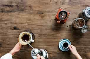 Free photo aerial view of people making drip coffee