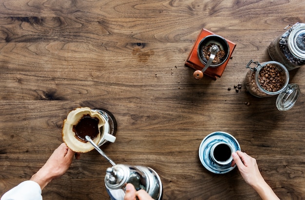 Aerial view of people making drip coffee