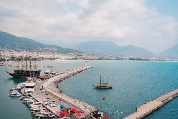 Aerial view of sailboats in Mediterranean seashore bay