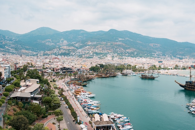 Aerial view of sailboats in Mediterranean seashore bay