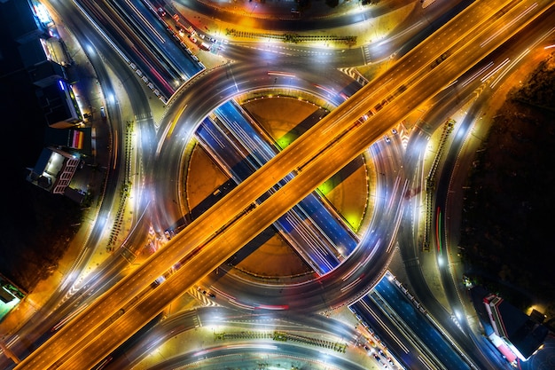 Free photo aerial view of traffic in roundabout and highway at night