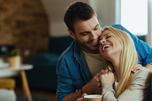 Affectionate couple enjoying in their love while spending time at home.