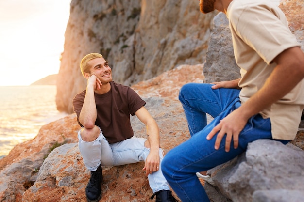 Affectionate gay couple spending time together on the beach