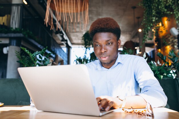 African american business man working with laptop