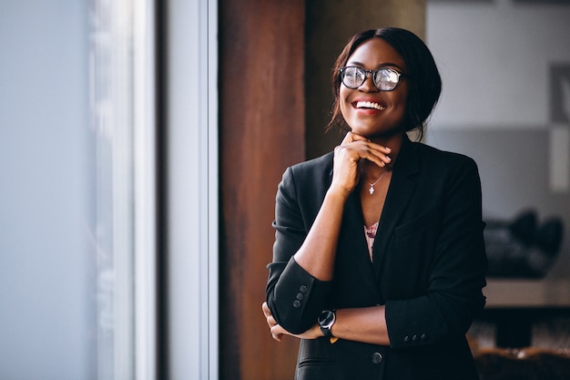 African american business woman by the window