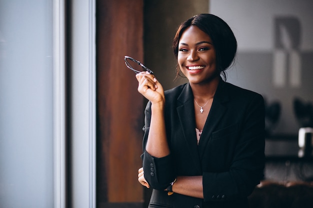 African american business woman by the window