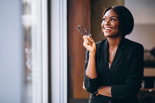 African american business woman by the window