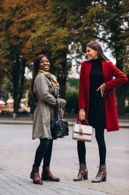 African american and caucasian women in the street