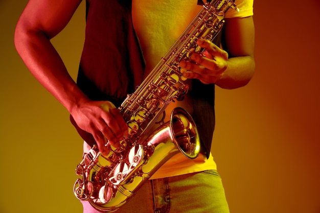 Free Photo african american jazz musician playing the saxophone.