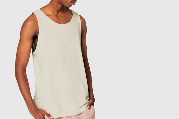 Free Photo african american man in creamy tank top sleepwear shoot