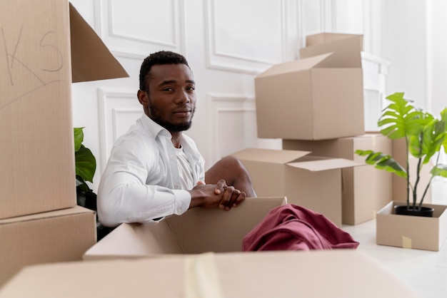 Free Photo african american man getting ready his new home to move in